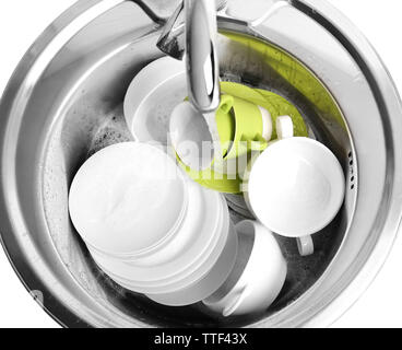 Pile of dishes in sink closeup Stock Photo