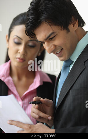 Indian two business executives going over documents Stock Photo