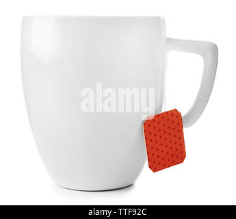 Cup of tea isolated on white background. Teabag with red dotted label Stock Photo