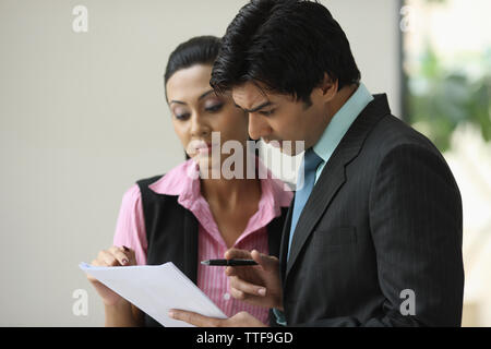 Two business executives going over documents Stock Photo