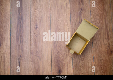 box empty open cardboard box on wooden surface with empty space top Flat lay Stock Photo