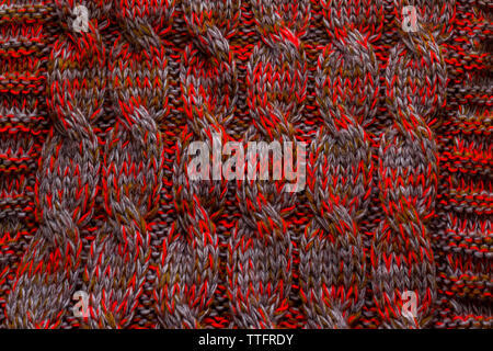Knitted texture of red gray dark green color Stock Photo
