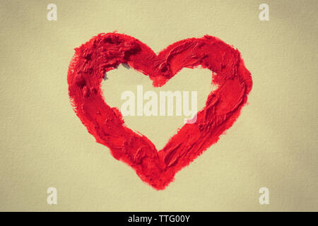 Red heart painted on light background Stock Photo
