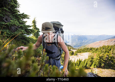 Backpacker on the move in the Coast Mountain Range, British Columbia. Stock Photo