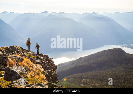 Two climbers silhouetted on Douglas Peak, British Columbia. Stock Photo