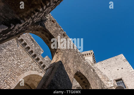 Low angle view of old castle against clear blue sky during sunny day Stock Photo