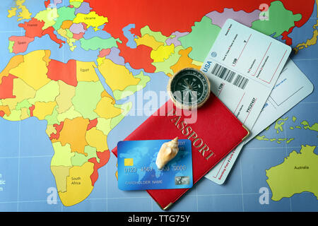 Credit cards with passports and tickets for vacations on the world map background Stock Photo