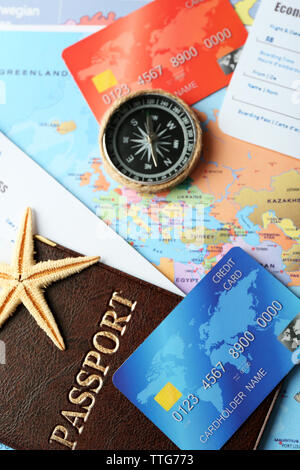 Credit cards with passports and tickets for vacations on the world map background Stock Photo