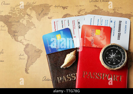 Credit cards with passports and tickets for vacations on the world map background Stock Photo