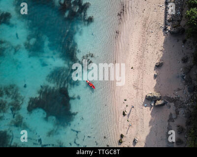 Man in kayak on the sea in turquoise water Stock Photo