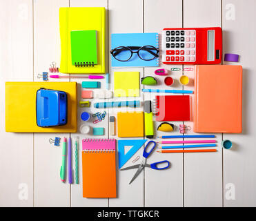 Flat lay of stationery on white wooden table background Stock Photo