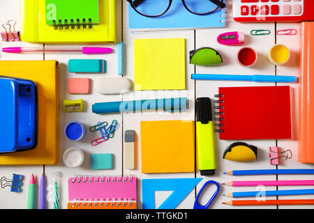 Flat lay of stationery on white wooden table background Stock Photo