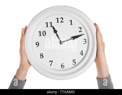 Man hands holding big round clock, isolated on white Stock Photo