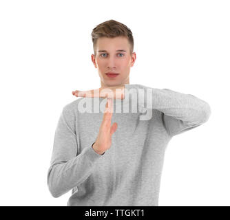 Young handsome man shows timeout, isolated on white Stock Photo