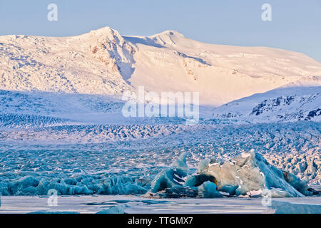 Idyllic view of glaciers against snowcapped mountains Stock Photo