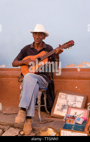 Musician playing on street. Real Life scene in Trinidad, Cuba. 2017. Stock Photo