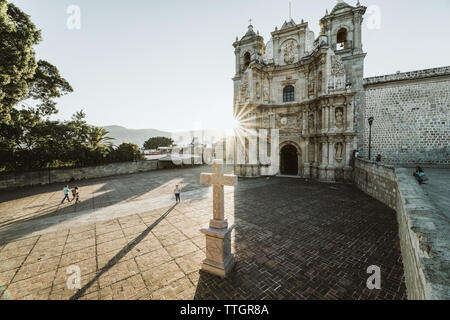 Almost empty courtyard of basilica in oaxaca city mexico at sunset Stock Photo
