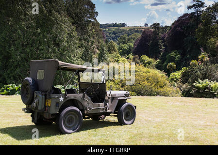 A WWII era Willys Jeep parked on the lawn in Trebah Garden in Cornwall. Stock Photo