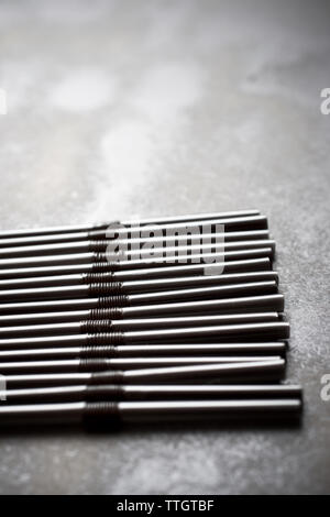 Drinking straws on a black table Stock Photo