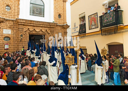 Holy Week. Brotherhood of La Palma. Nazarenes and Cross of Guide (head of the procession). Cadiz. Region of Andalusia. Spain. Europe Stock Photo