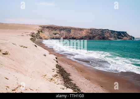 Scenic view of Playa Colorada, red sandy beach, Paracas,Peru Stock Photo