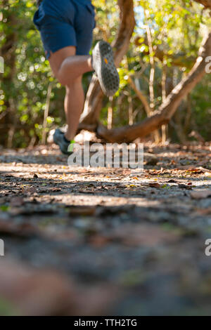 Out of focus image of a man's legs as he's outside on a run. Stock Photo