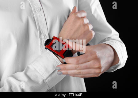 Modern watch on a woman's wrist, close up Stock Photo