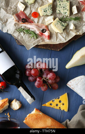 Wine, snacks and different various of cheese, flat lay Stock Photo