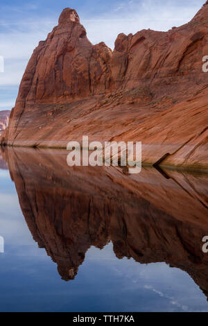 Red cliff reflection on Lake Powell Stock Photo