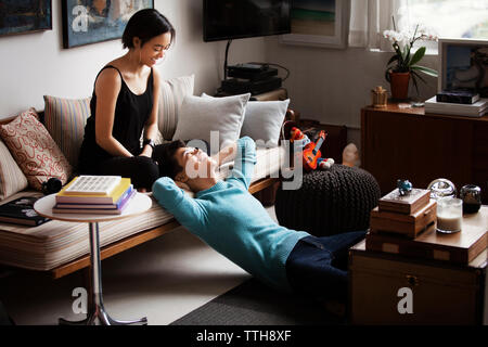 Happy couple spending quality time in living room Stock Photo