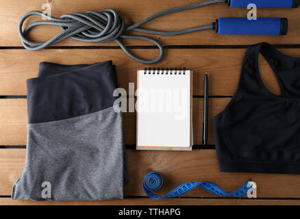 Female sport equipment on a wooden background Stock Photo