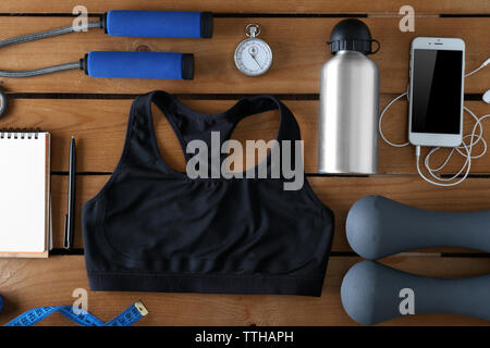 Female sport equipment on a wooden background Stock Photo