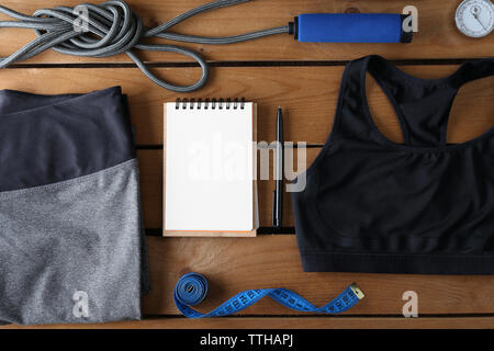 Female sport equipment on a wooden background Stock Photo