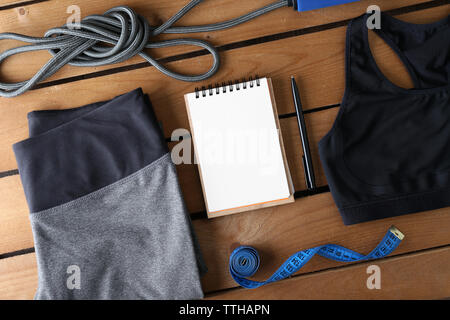 Female sport equipment on a wooden background Stock Photo