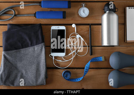 Female sport equipment on a wooden background Stock Photo
