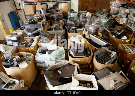 High angle view of various electrical equipments in boxes at recycling plant Stock Photo