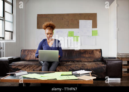 Photo editor using laptop in office Stock Photo