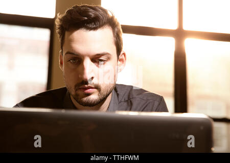 businessman working on laptop in creative office Stock Photo