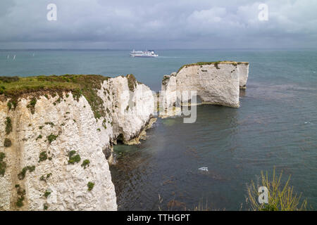 A Brittany Ferry passing Old Harry Rocks at Handfast Point, Isle of Purbeck, Jurassic Coast, a UNESCO World Heritage Site in Dorset, England, UK