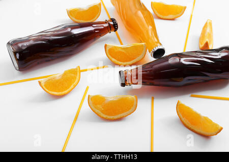 Bottles with fresh different drinks isolated on white Stock Photo