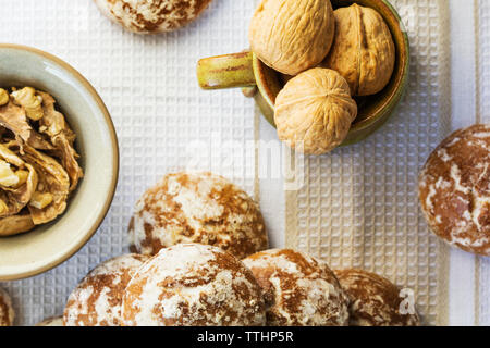Overhead view of breads and walnuts on table Stock Photo