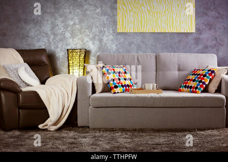 Design interior with sofa against grey wall background Stock Photo