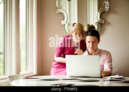 Couple doing online shopping at home Stock Photo