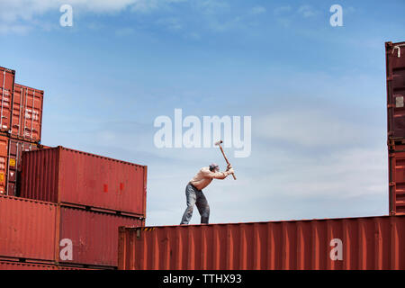 Worker working on cargo container at commercial dock Stock Photo