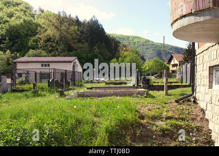 Old church with a cemetery in the backyard in the mountain village Martin Brod, Bosnia and Herzegovina
