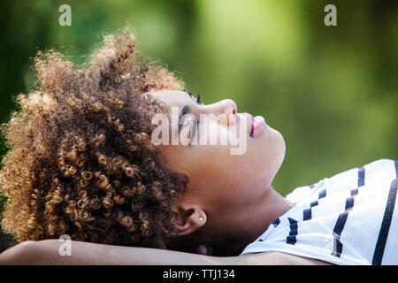 Close-up of thoughtful teenage girl lying down Stock Photo