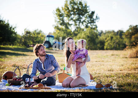 Family enjoying picnic on sunny day Stock Photo