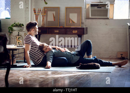 Gay couple relaxing on living room at home Stock Photo