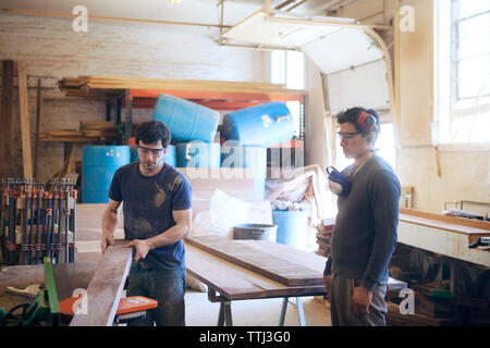 Male carpenters working in workshop Stock Photo