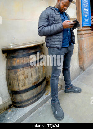 London, England, UK. Man on his mobile phone in Whitehall Stock Photo